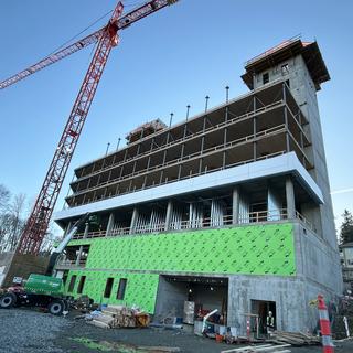 a construction site with a crane overhead